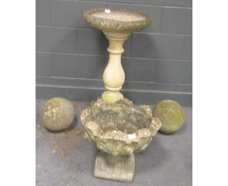 A composite stone birdbath with dish top and baluster support 88.5 x 49cm; together with a leaf moulded composite stone garde