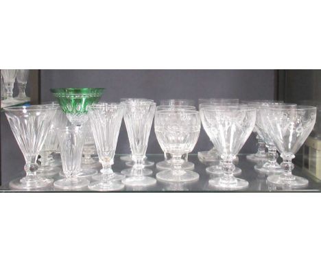 Five matching etched large rummers or sundae glasses decorated with bows, ribbons and flowers, supported on a knopped stem; a