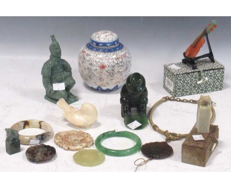 A green mottled jade figure of a gold prospector, a model of a violin made of numerous specimens, 2 bangles, 4 pendants, two 