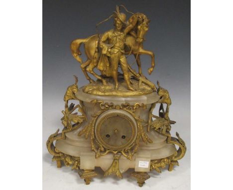 A brass and alabaster mantel clock with horse, plough and ploughman flanked by two ram's heads, 44cm x 37cm x 17cmplease see 