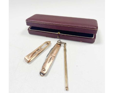 A 9ct gold swizzle stick, a 9ct gold and steel penknife and a tie clip stamped 9ct (3)