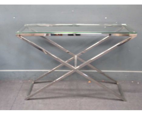 Rectangular glass and chrome console table with x-frame support and glass top. 76 x 113 x 36cmTop has light scratching, (it i