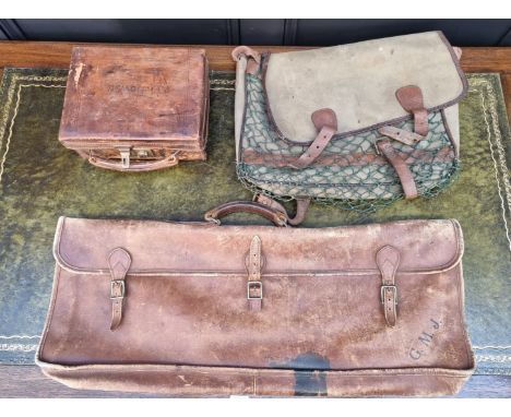 A vintage green leather toilet case,&nbsp;(lacking contents); together with three other cases. (4) 