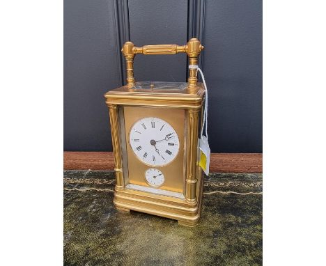 A good gilt brass carriage clock,&nbsp;with alarm, push button repeat and twin gong strike, height including handle 18.5cm.&n