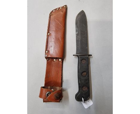 A British Army survival knife and leather sheath,&nbsp;with broad arrow.