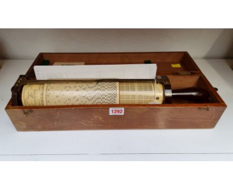 A vintage Fuller's spiral slide rule, with brown Bakelite handle, in mahogany box.&nbsp;&nbsp; 