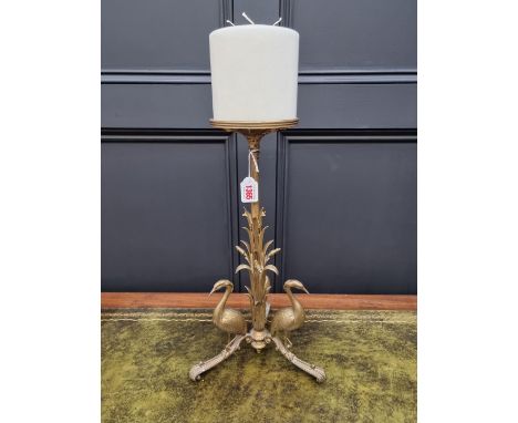 A large and unusual gilt brass candlestick, 46m high. 