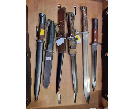 Five old bayonets,&nbsp;comprising:&nbsp;a British 1903 pattern example; a German M1898 sword (butchers) bayonet, mark indist