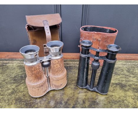 Two leather cased pairs of vintage field glasses.&nbsp; 