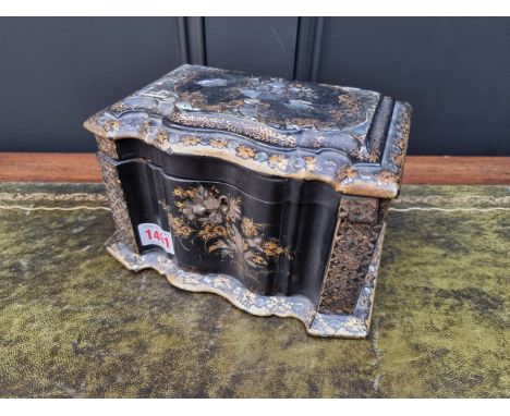 A Victorian papier-mache and mother of pearl tea caddy,&nbsp;21.5cm wide, (lacking feet).&nbsp; 