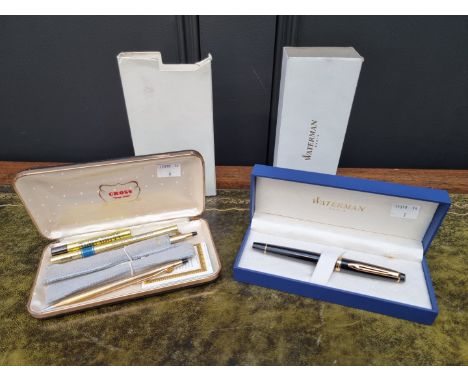 A Waterman ballpoint pen,&nbsp;boxed; together with two other gilt pens.&nbsp; 