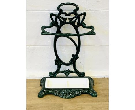 Cast iron enamel painted stick stand, with white painted drip tray, 60cms. Estimate £30-50.