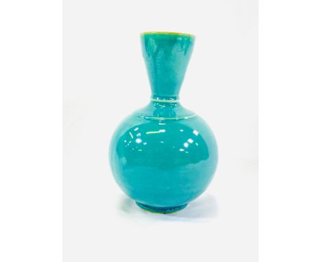 An Oriental turquoise vase with flared neck, 21cm. Estimate: £25-50
