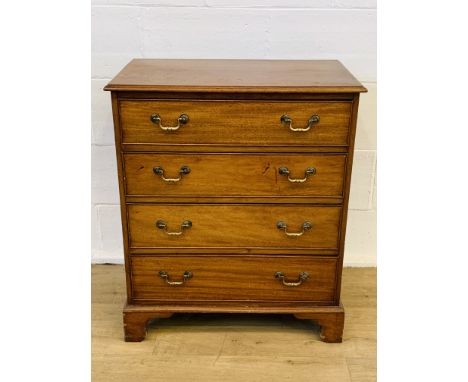 Mahogany chest of four drawers with brass handles to bracket feet, 78 x 45 x 91cms. Estimate £50-80.