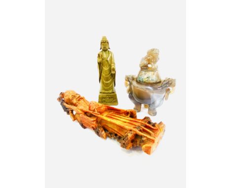 An Oriental jade lidded pot with handle rings, 17cms; a soapstone figure of an Oriental gentleman, 27cms, carved stone figure