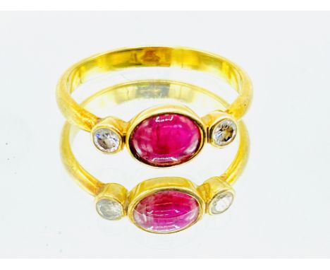 A 14ct gold ring, set with a ruby and diamond chips to shoulders, 1.8g, size K. Estimate: £70-90
