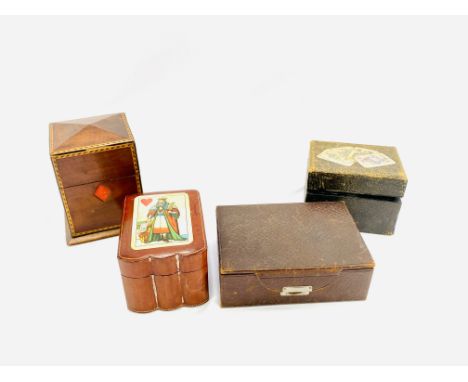 An Italian leather box containing three packs of playing cards decorated to the lid with the king of hearts; a mahogany box d