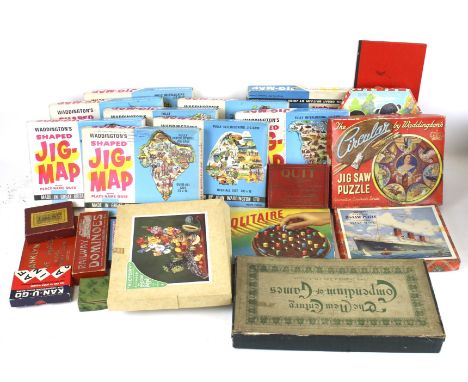 An assortment of vintage family games. Including jigsaw puzzles, card games, marble checkers, a bagatelle board, etc.