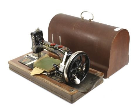 A vintage hand crank sewing machine cased. By Williams &amp; Co. Ltd, Manchester Boat Shuttle sewing machine plus a small pok