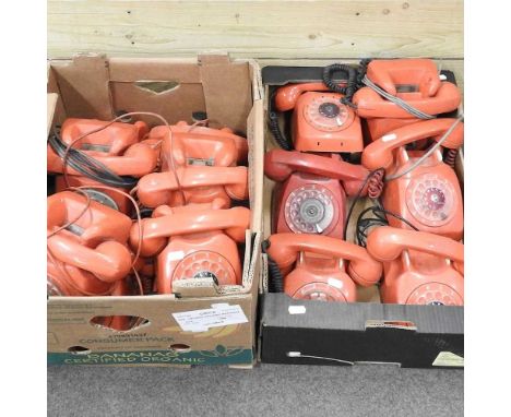 A collection of red vintage telephones