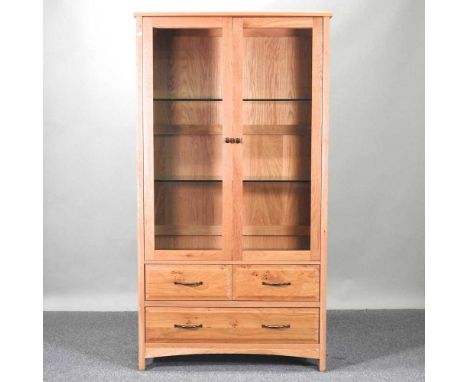 A modern oak display cabinet, with drawers below100w x 40d x 186h cm