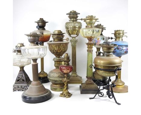 A collection of ten various mainly 19th century oil lamp bases, tallest 60cm (10)