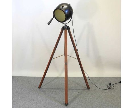 A standard lamp, with a diver's helmet shade, on a tripod base, 166cm high