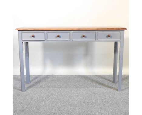 A pine and blue painted side table, containing four short drawers126w x 37d x 76h cm