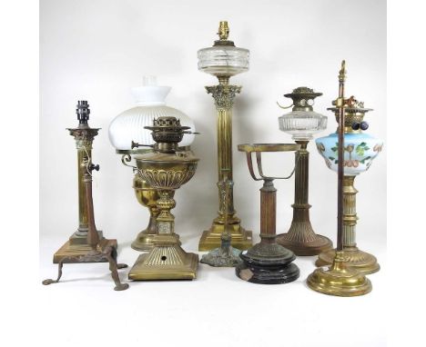 A collection of ten mainly 19th century oil lamp bases, highest 67cm (10)