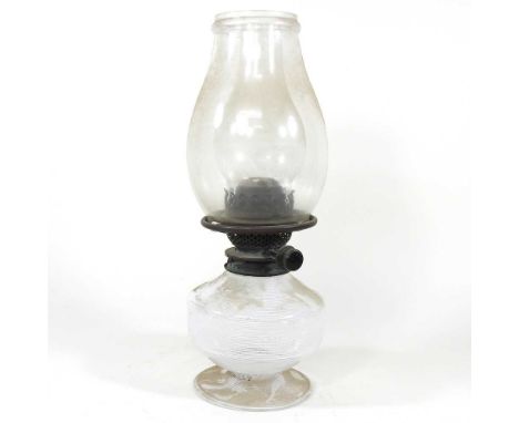 A glass oil lamp, of Nailsea style, 38cm high