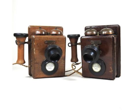 Two vintage wooden telephones, 24cm high (2)