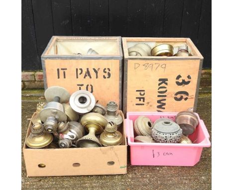 A collection of brass oil lamp bases and fonts