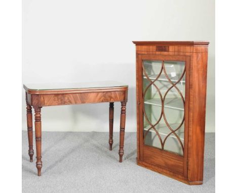 A late Regency mahogany folding tea table, 91cm wide, together with a George III glazed hanging corner cabinet, 71cm wide (2)