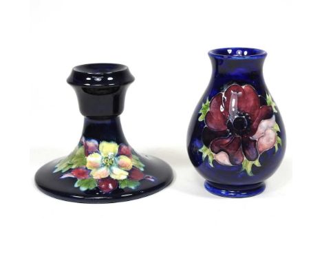 A Moorcroft pottery candlestick, together with a small vase, 10cm high (2)