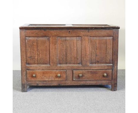An 18th century oak mule chest, with a hinged lid and drawers below, inscribed with initials M D and dated 1782124w x 53d x 8
