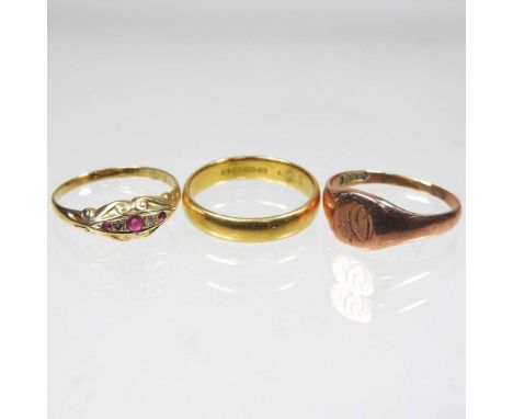 A 22 carat gold wedding band, 5.3g, size S, together with a 9 carat gold signet ring, 3.6g and a gold ring, 2.3g, marks rubbe