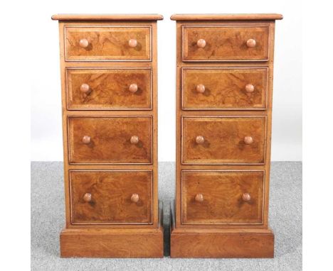 A pair of good quality handmade walnut, crossbanded and feather banded bedside chests, each containing four short drawers (2)