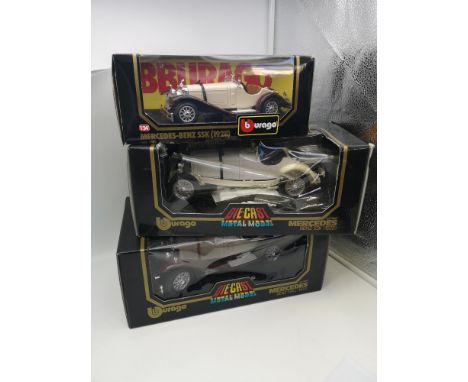 A collection of 3 Burago Mercedes Benz car models (two 1/18 scale models and one 1/24 model) 