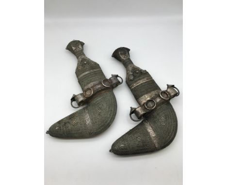 A Pair Early 20th century Arab Jambiya daggers with silver filigree decoration. From Saudi Arabia, Fine quality silver decora