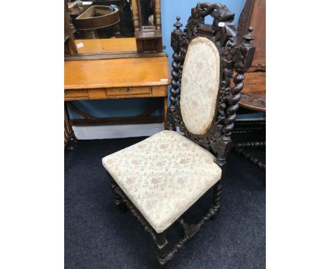 A Victorian highly carved dining room chair, detailed with foliage and grape carvings, Barley twist supports and light materi
