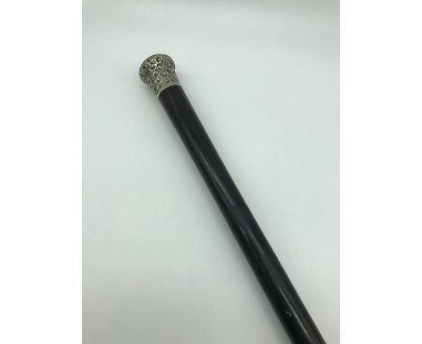 A Victorian ebony walking stick with a white metal handle (86cm) 