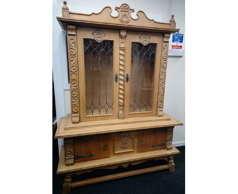 A light oak Danish boardroom dresser on base completed in a Jacobean style (179x135x48cm) 