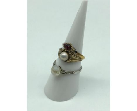 A 22ct gold ladies ring set with a Garnet/ Ruby stone. A 9ct gold ladies ring set with a single false pearl. Also together wi