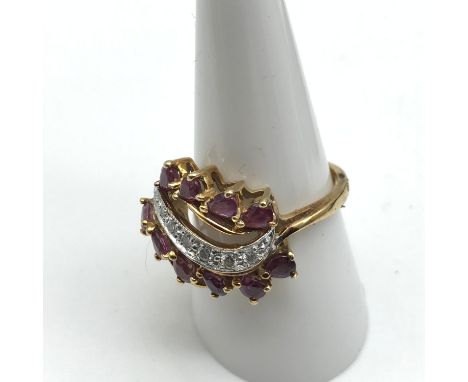 A 14ct gold ladies ring set with Diamonds and Ruby stones. 