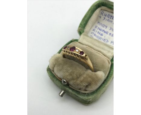 An 18ct gold ladies ring set with 3 Ruby &amp; 2 diamond stones. Originally belonged to Mary Dowson. engaged and married in 1