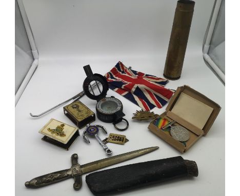 A mixed lot of Military war items to include 1919 brass shell, 1940 MK3, a compass, two matchbox holders, a WW2 defence medal