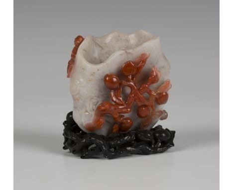 A Chinese two-tone agate libation cup with hardwood stand, 20th Century, the pale grey stone cup formed as a tree trunk, one 