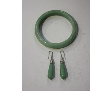 A Chinese jadeite bangle, modern, inner diameter approx 6.4cm, together with a pair of faceted jadeite drop earrings.