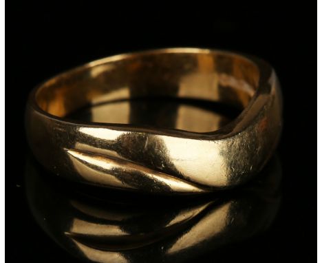 A gold ring in a curved abstract design, ring size approx N.