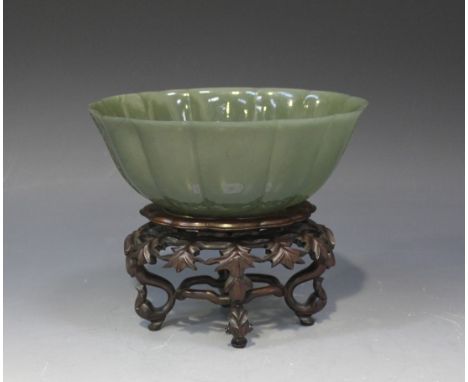 A Chinese Mughal style jade bowl, Qing dynasty, of deep lobed oval form, the sides carved in low relief with acanthus, the st